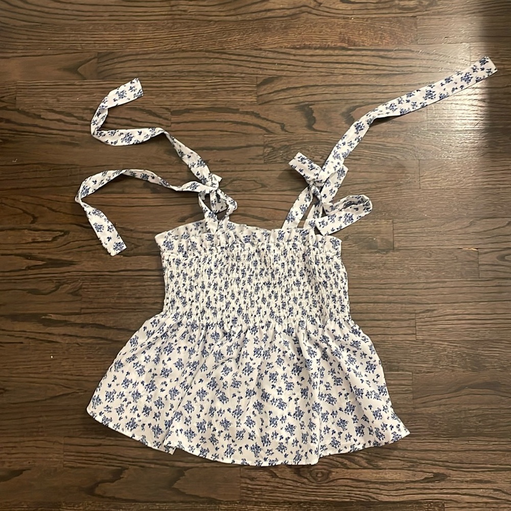 White and blue floral blouse